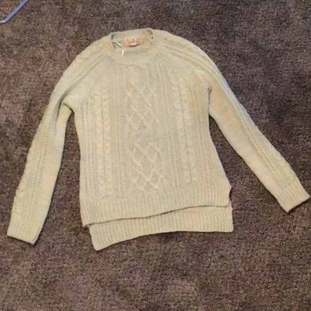 Girl’s mint green and cream sweater